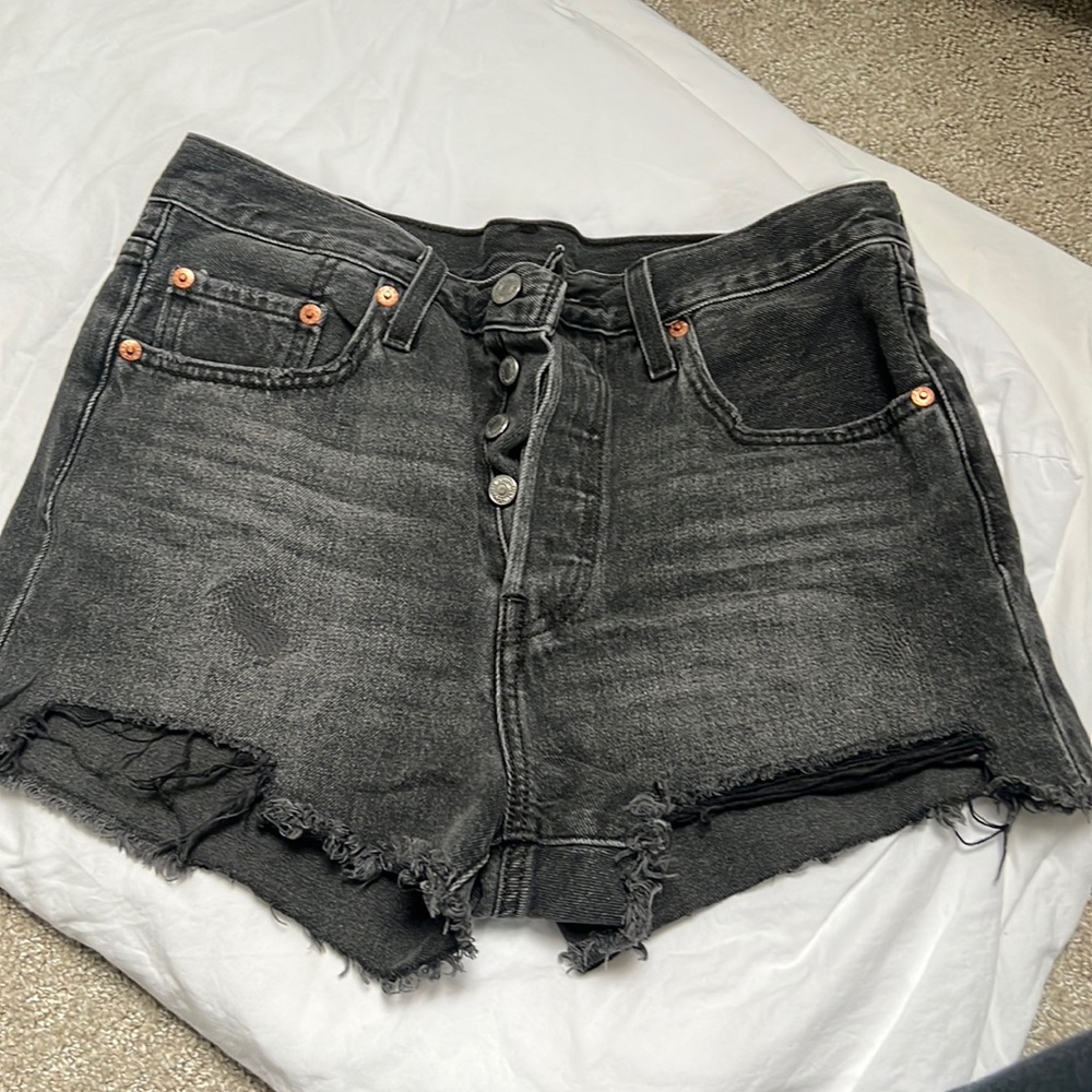 Levi’s black patched ripped jeans